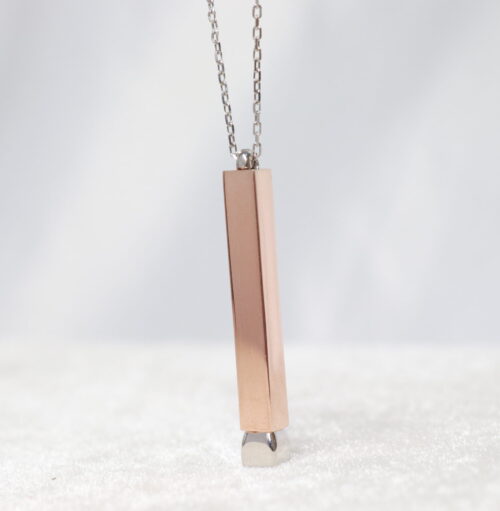 Silver rose plated bar pendant with silver removable piece at bottom