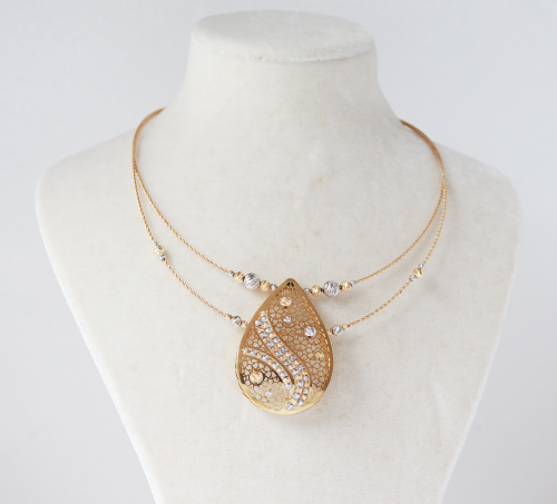 18ct yellow and white gold pear shaped centre piece on necklace, bracelet and earring set