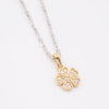 18ct white gold chain with 18ct yellow gold flower pendant