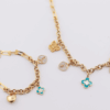 18ct yellow gold chain and bracelet set with cubic charms