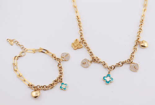 18ct yellow gold chain and bracelet set with cubic charms