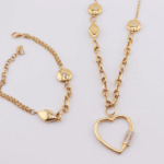 18ct yellow gold fancy chain and bracelet set with charms and cubics